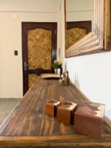 a wooden table with two wooden boxes on it at Apart Mirador del Valle in Cachí