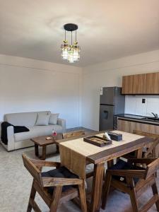 a living room with a table and a couch at Apart Mirador del Valle in Cachí