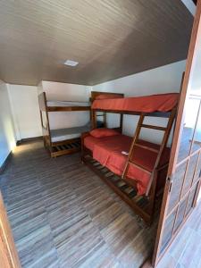 a small room with two bunk beds in it at Casa playa crucita in Crucita +6 photos