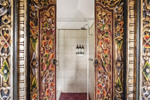 a bathroom with a shower with a mirror at Riveresque - Spa Bath - Forest Views in Margaret River Town