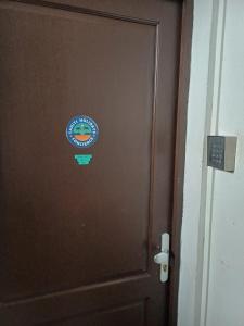 a door with a sign on top of it at SWEET - City center room Papeete in Papeete