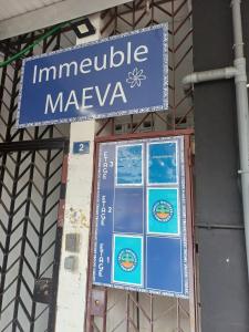 a sign on the side of a building at SWEET - City center room Papeete in Papeete +1 photo