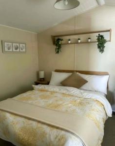 a bedroom with a large bed in a room at Seashells - Exclusive Private Area to Side in Coldingham