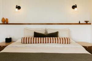 a large white bed with two pillows on it at Monapilla Escape in McLaren Vale