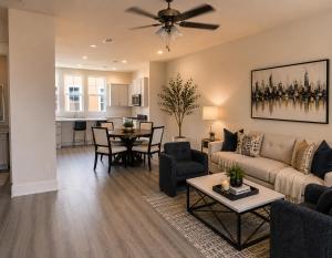 a living room with a couch and a table at Collin Creek Executive Residence in Plano