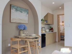 a kitchen with a table and chairs in a room at Vip villa in Phú Quốc