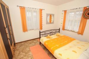 Postel nebo postele na pokoji v ubytování Apartments Nino