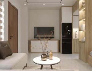 a living room with a couch and a table at Westlake House By Jen in Hanoi