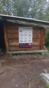 a sign on the side of a log cabin at Kerben yurt camp in Mineralʼnyy Istochnik Altyn-Arasan