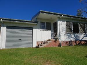 a house with a garage at Beach Break in Tathra