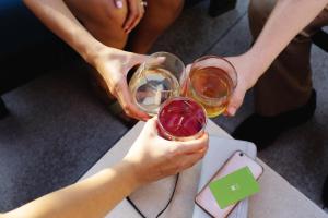 two people holding wine glasses in their hands at Hyatt House Morristown in Morristown