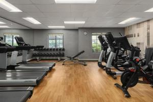 a gym with treadmills and exercise bikes in it at Hyatt House Morristown in Morristown