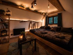 a bedroom with a large bed in a room at Chata Malenovice in Malenovice