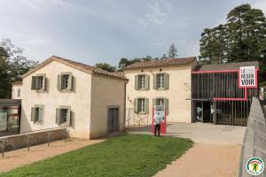 a man standing in front of a building at La maison imart in Revel