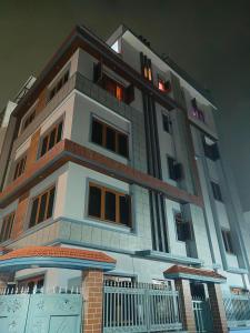 a tall building with a lot of windows at Durbar Home in Tribhuwan Airport