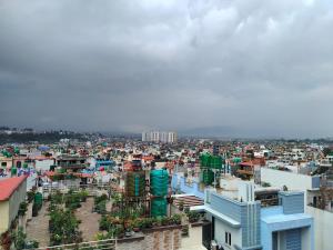 a view of a city from a building at Durbar Home in Tribhuwan Airport +1 photo