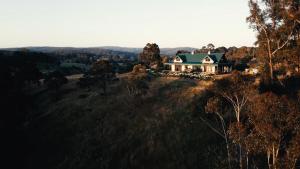 a house sitting on top of a hill at Hank's Folly in Wapengo