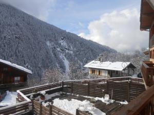 a view of a snow covered mountain from a house at La Lonzagne in Peisey-Nancroix