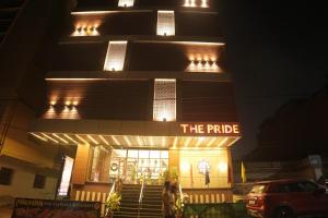 a building with a sign that reads the pride at The Pride in Jamshedpur
