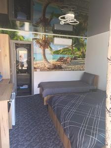 a room with two beds and a painting on the wall at Sofia Armony in Iezureni