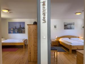 a bedroom with two beds in a room at Objekt-Nr 237 - Priwall - Mecklenburger Landstraße in Priwall