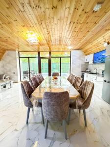 a dining room with a table and chairs at Lerik Forest House in Lerik