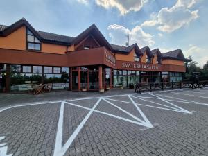 an empty parking lot in front of a building at garni Hotel ASAS*** in Most
