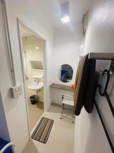 a small bathroom with a sink and a mirror at 3199 Cafe' Latya & Bed in Ban Lum Makok +48 photos