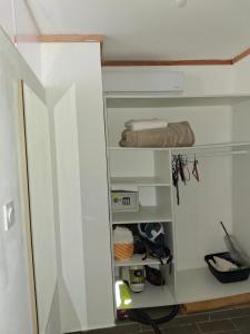 ajar view of a closet in a room at Studio plain pied in Saint-Pierre