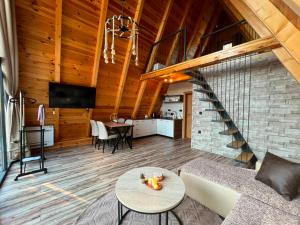 a living room with a couch and a table at Golden Horizon in Žabljak