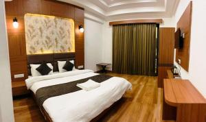 a hotel room with a large bed and a desk at Horizon Resort Pushkar-Feel of The Nature in Pushkar +64 photos