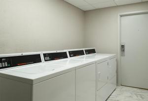 a room with three microwaves sitting on a counter at Hampton Inn & Suites - Vicksburg in Vicksburg