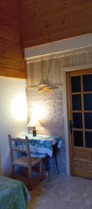 a room with a table and a lamp and a door at villa Garibaldi in Agüero +39 photos