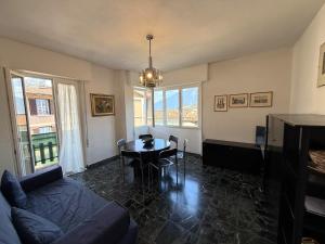 a living room with a couch and a table at Casa Liver Pieve in Tremosine Sul Garda