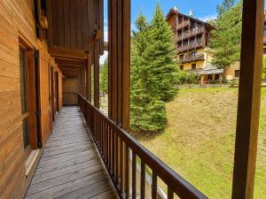 a wooden walkway on a porch of a house at Hostdomus - A3-24 in Grange Sises