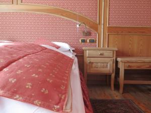 En eller flere senge i et værelse på Chambres Mont Cervin