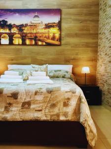 a bedroom with a bed and a painting on the wall at The Best Nest in Rome +27 photos