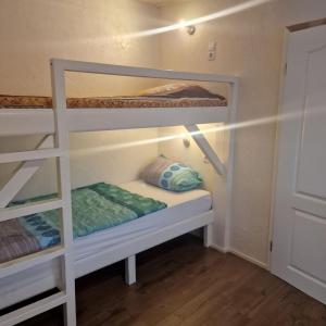 a bunk bed room with two bunk beds in it at Monteurunterkunft Zesch am See in Zossen