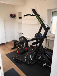 a gym with a treadmill and a bike at Il Pumo in Locorotondo