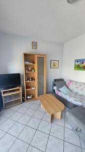 a living room with a bed and a coffee table at House Peri in Trogir