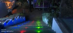 a view of a street at night with colored lights at Laya Neem Resort in Dambulla