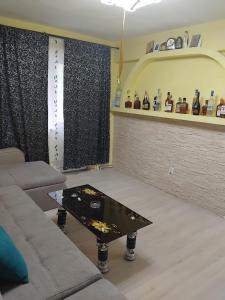 a living room with a couch and a coffee table at D&ATurism in Băile Govora