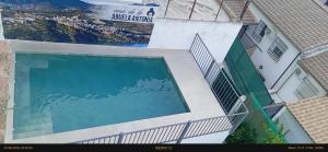 an overhead view of a swimming pool in a building at Geysotur Casa de la Abuela Antonia in Iznájar