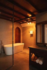a large bathroom with a tub and a sink at ALy's Sapa in Tả Van