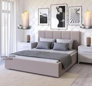 a bedroom with a large white bed in a room at شقق القنفذة بلس in Al Qunfudhah