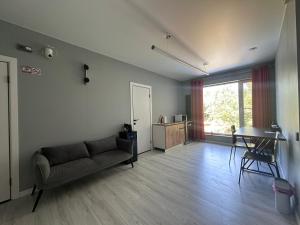 a living room with a couch and a table at Altura House in Almaty