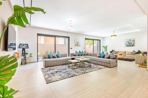 a living room with two couches and a table at Villa Horizon Premium - Private Pool - Fully Renovated - Marrakech in Marrakesh