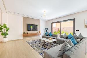 a living room with a couch and a table at Villa Horizon Premium - Private Pool - Fully Renovated - Marrakech in Marrakesh +38 photos