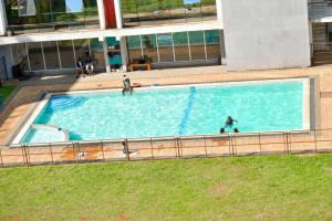an overhead view of a large swimming pool on a building at Ngong Road Luxe Studio in Nairobi