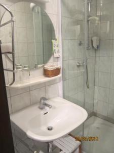 a bathroom with a sink and a shower at Landhaus Ingrid in Loich +29 photos
